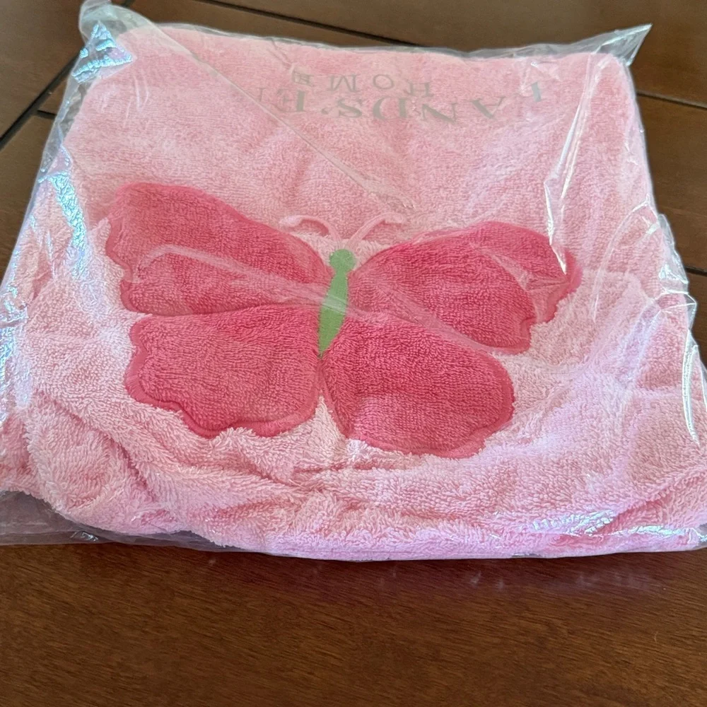 Pink hooded baby towel with a butterfly design. Land’s End